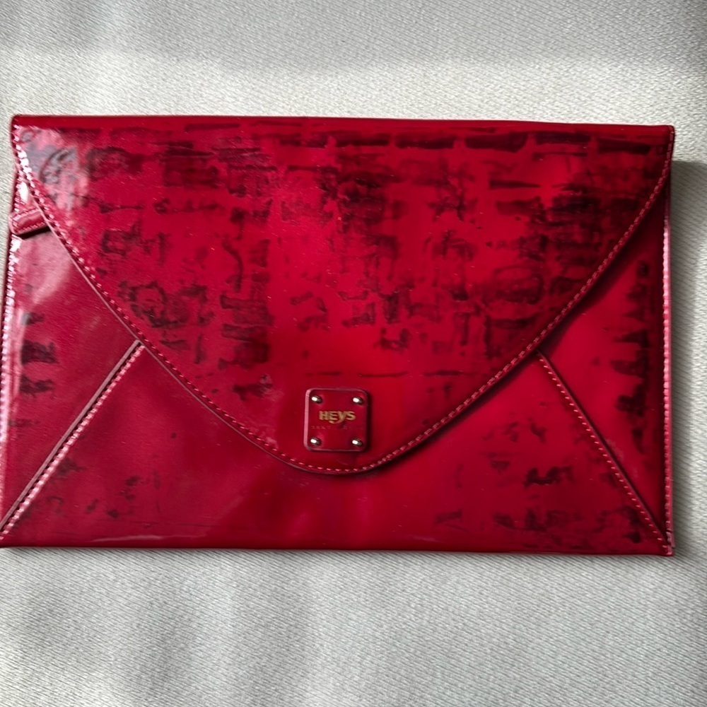 Heys envelope in deep red with black stamps in patent leather